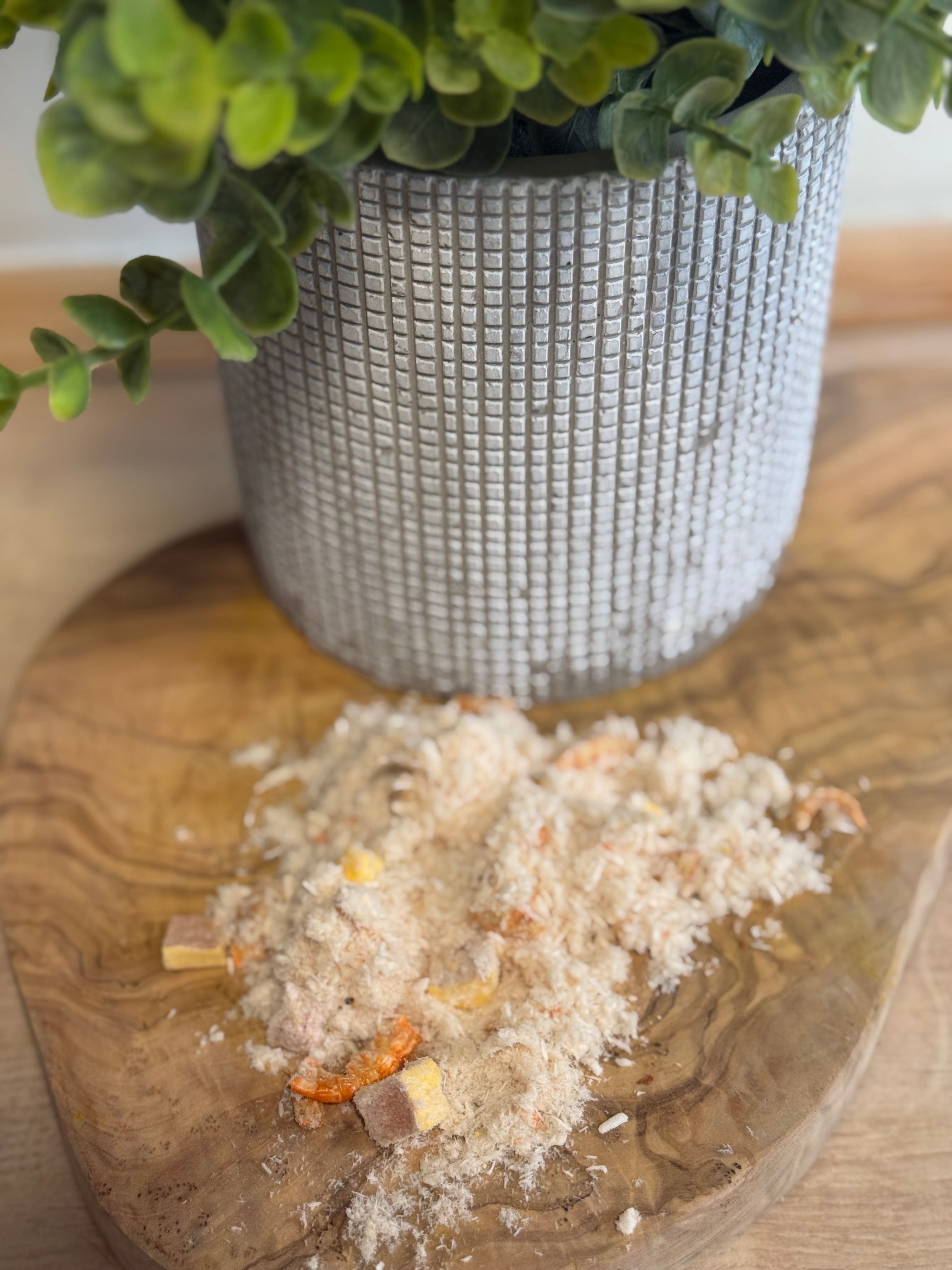 Freeze dried chicken shrimp and yolk topper.